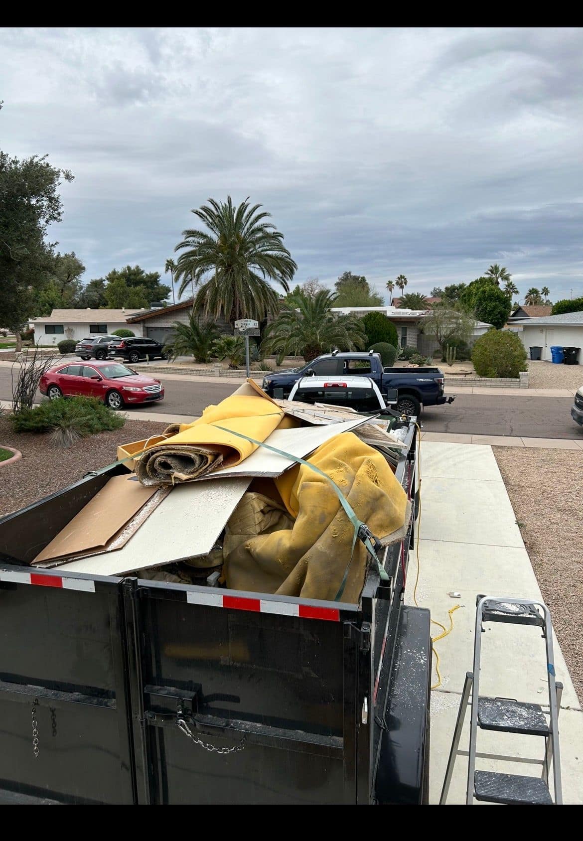 Trailer loaded with carpet and flooring debris